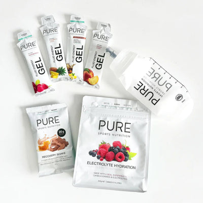 Text of what is inside the Pure Gift Box, Pure Electrolyte Hydration 500g - Superfruits, Pure 500ml Clear Soft Bottle, Pure Recovery Shake Single Serve, 4 Pure Fluid Energy Gels, Flavours may vary depending on stock availability