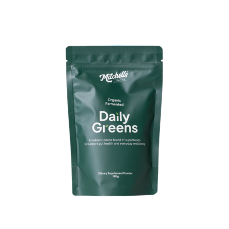 A Supplement container with the name  Daily Greens by Mitchell's Nutrition.